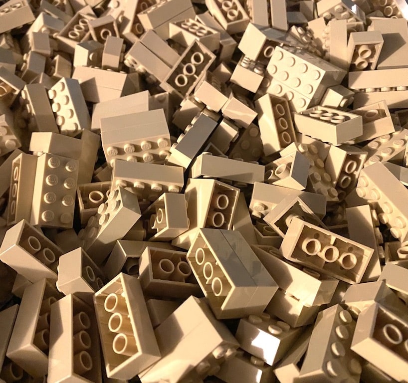 Closeup photo of lots of 2x4 tan LEGO bricks